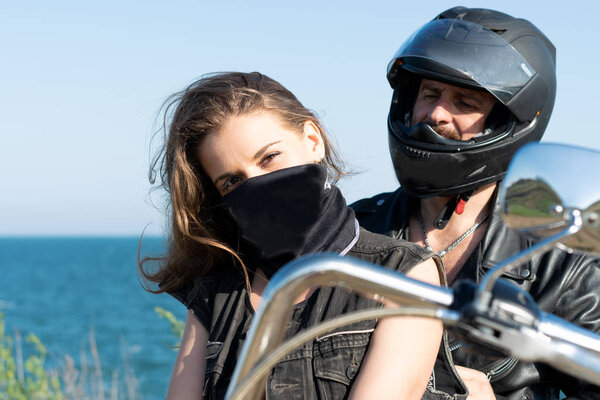 hot passion couple enjoying the life together. bikers on the road. hot woman and handsome guy