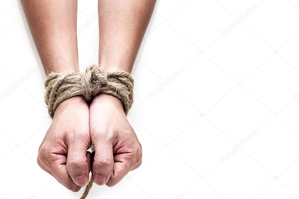 victim, slave, prosoner male hands tied by big rope isolated on 