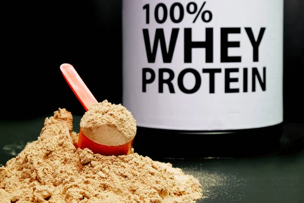Whey Protein Powder in measuring scoop. — Stock Photo, Image