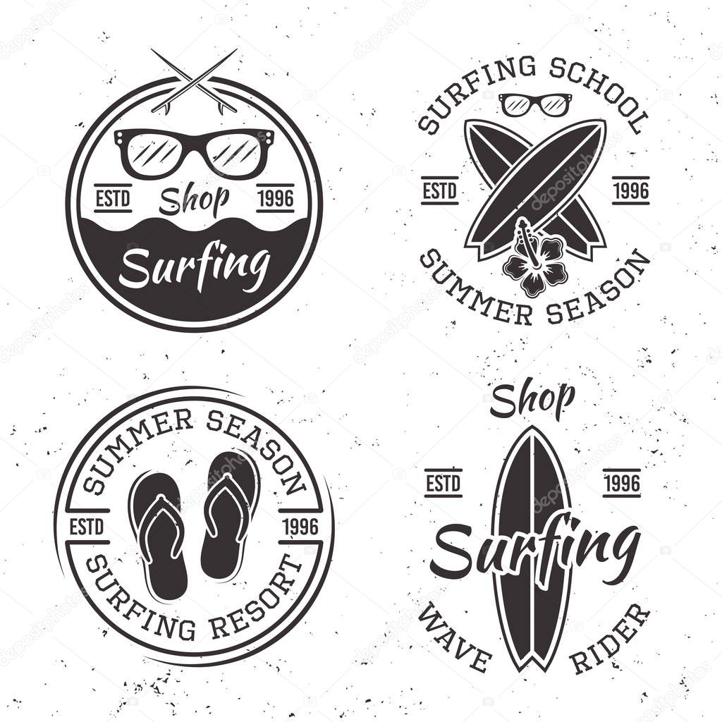Set of four vintage surfing emblems and badges