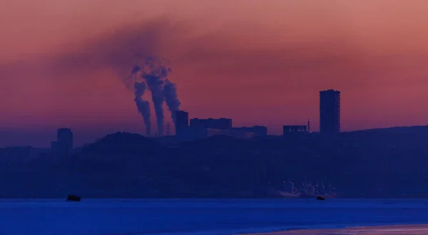 Dawn in the sea city of Vladivostok. Ecological situation in the city