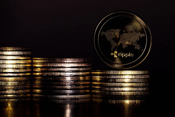 4K Physical metal golden Ripplecoin currency rotating over others coins. Worldwide virtual internet money. Digital Ripple coin cyberspace, cryptocurrency XRP.