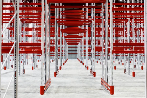 Empty storage facilities in the logistics center. Empty shelving in a warehouse.