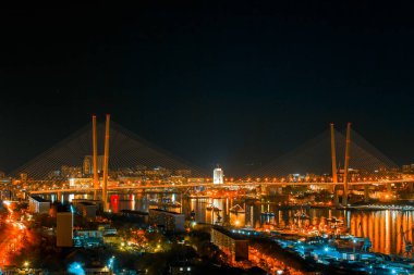 Panorama of the city of Vladivostok. Panoramic view of the Golden Horn and the central part of Vladivostok from one of the hills of the city at sunset time.