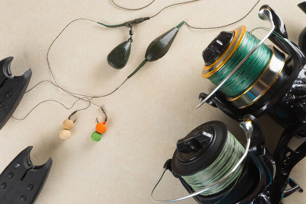 Baits, hooks, sinkers, reels, is preparing for carp fishing. Copy paste