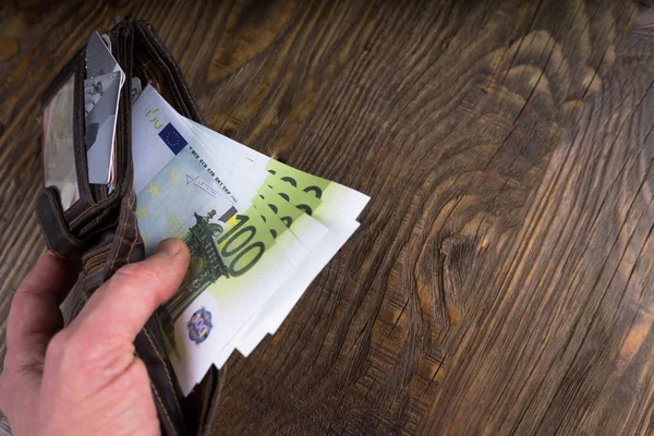 Open wallet with hundreds in the male hand — Stock Photo, Image