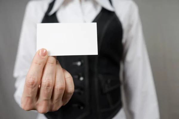 Businesswoman holding a business card. Mock up. Copy space.