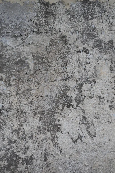 Eski yıpranmış sıva yüzeyi ile çatlaklar. Paslı sıva doku. Arka plan. Alçı. Duvar.