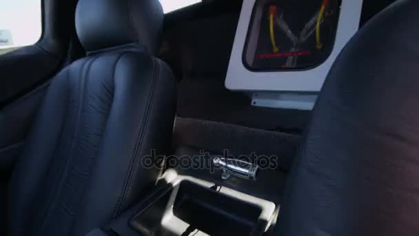 Tilt up to flux capacitor on interior of delorean — Stock Video