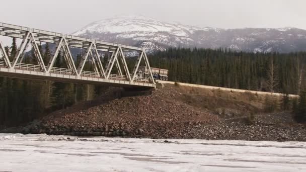 Ore truck on stikine river bridge on cassiar highway — Stock Video