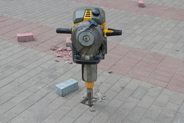 Jackhammer and pavement tiles. — Stock Photo, Image