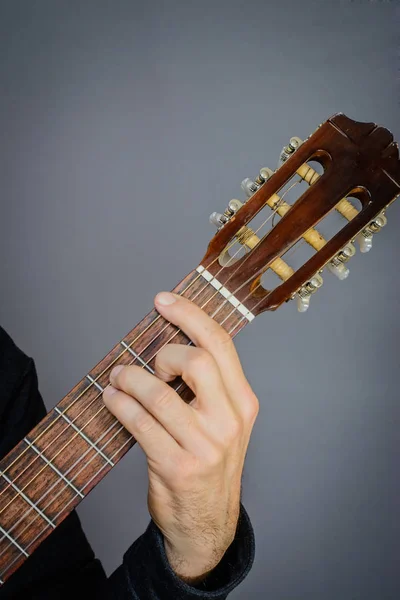 F major  open chord played by Guitarist on classical acoustic gu