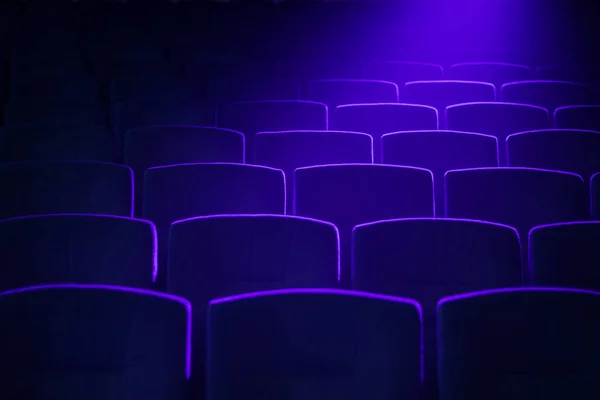 Empty movie theater with projection light falling into the lens