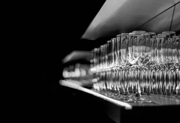 Bar glasses on the mirror shelf