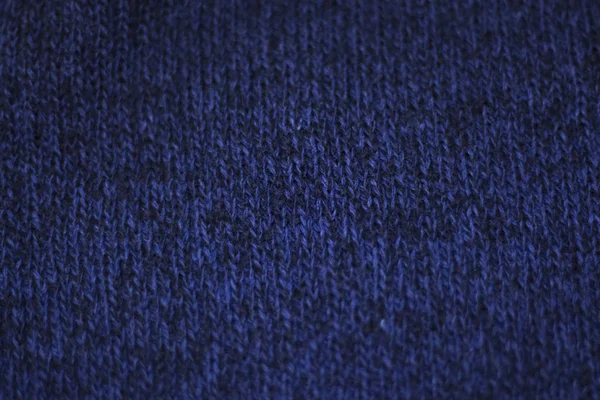 La texture d'un tissu de laine tricoté bleu. Contexte — Photo
