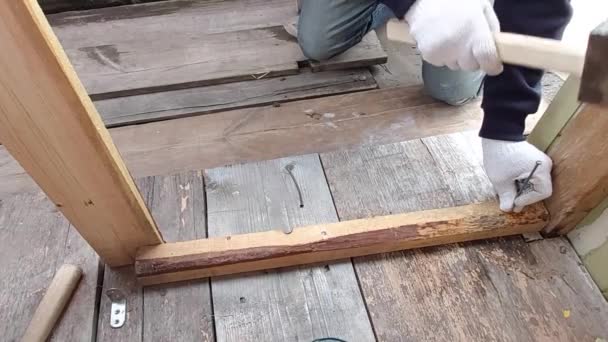 Man Drives Nail Hammer Wooden Block — Stock Video