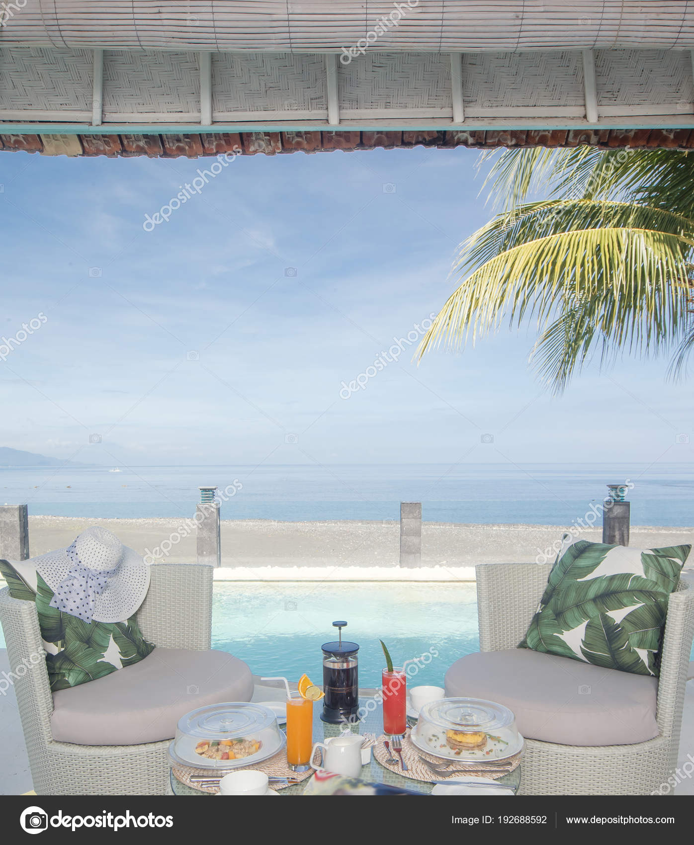 Fresh Breakfast Setup Juice And Coffee On Table Next To The