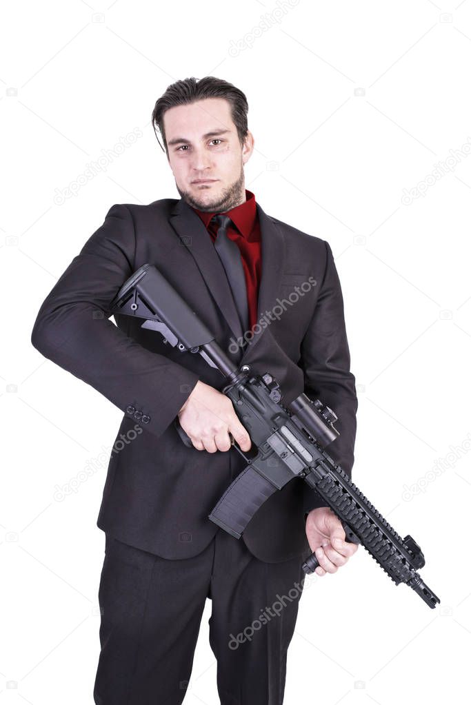 Elegant gangster holding rifle gun, isolated on white background.