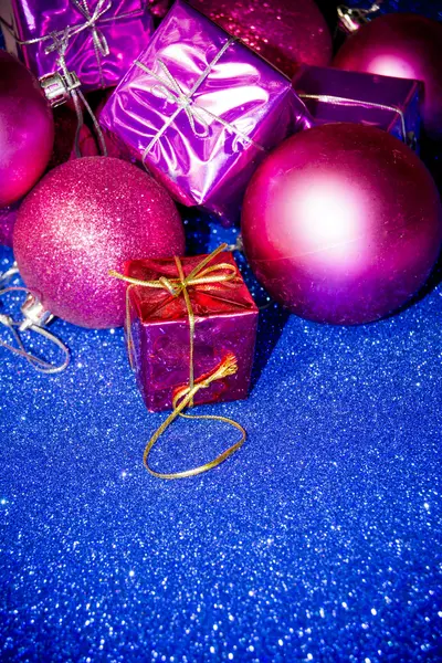Gifts and Christmas decorations on blue background — Stock Photo, Image