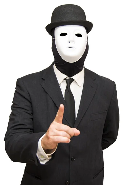 Uomo d'affari con una maschera bianca e un cappello puntare il dito contro t — Foto Stock