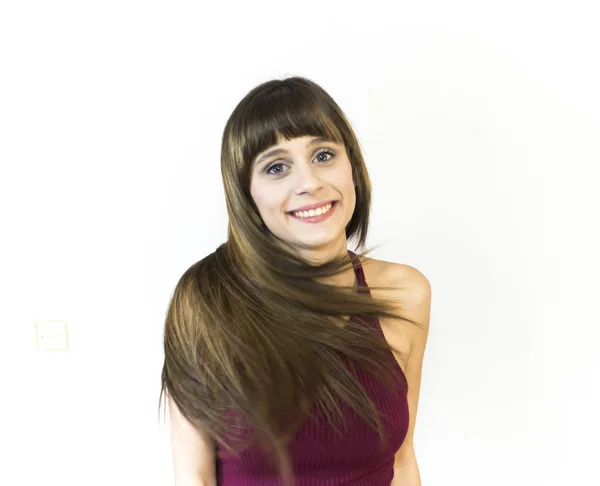 Retrato de una hermosa joven agitando su cabello —  Fotos de Stock