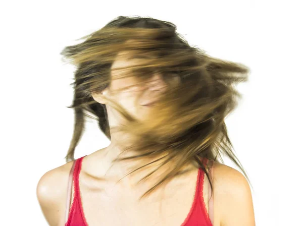 Retrato de una hermosa joven agitando su cabello —  Fotos de Stock