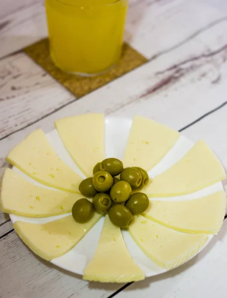 Cheese with Olives and Orange Juice. Healthy food on a white woo — Stock Photo, Image