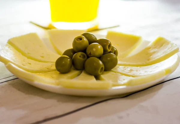 Cheese with Olives and Orange Juice. Healthy food on a white woo — Stock Photo, Image