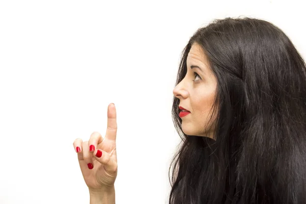 Portrait of a beautiful woman pointing up with her finger — Stock Photo, Image