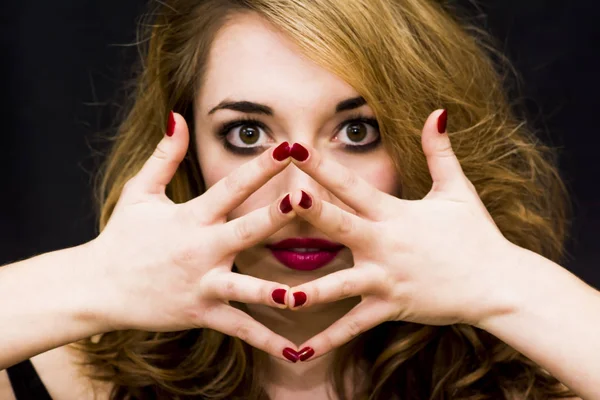 Beautiful woman with her hands outstretched in front of her over — Stock Photo, Image