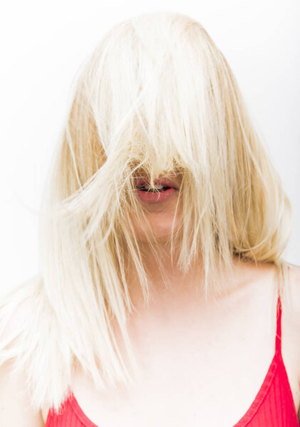 Portrait of Beautiful Blond Woman Shaking Her Hair 