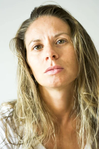 Portrait of the face of a beautiful blond woman on white backgro — Stock Photo, Image