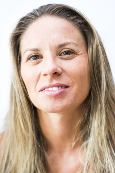 Portrait of the face of a beautiful blond woman on white backgro — Stock Photo, Image