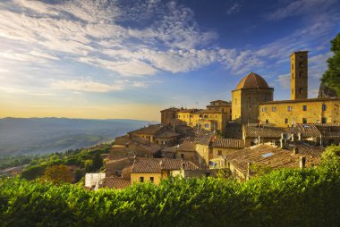 Tuscany, Volterra town skyline, church and panorama view on suns clipart