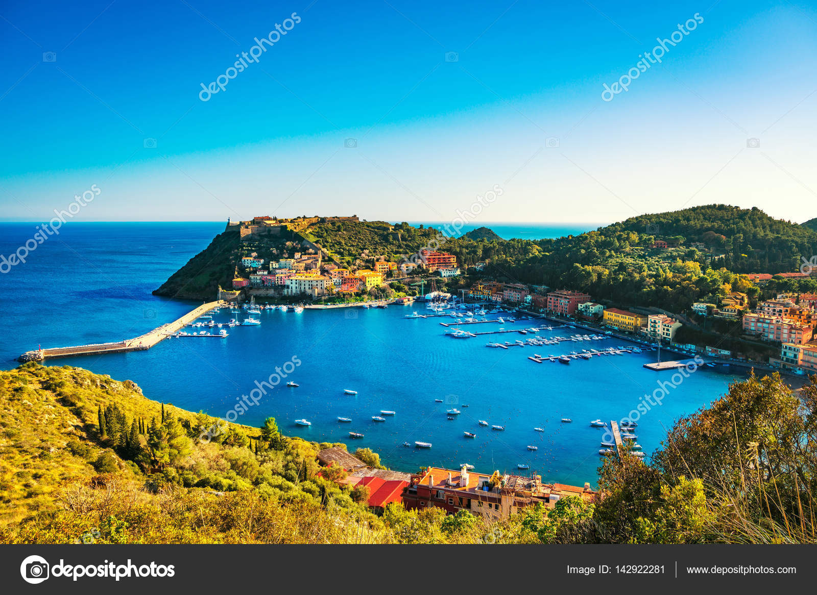 Porto Ercole village and harbor in a sea bay. Aerial view, Argen Stock