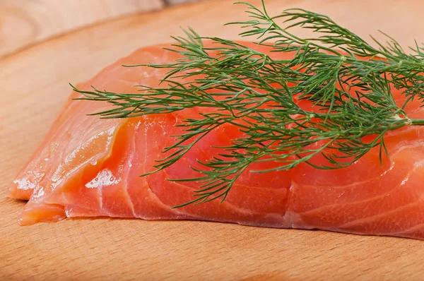 Fischfilets auf altem Holzgrund. — Stockfoto