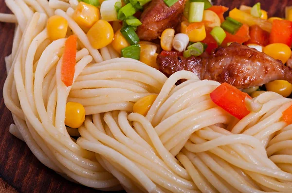 Pasta with vegetables and turkey meat, diet menu.