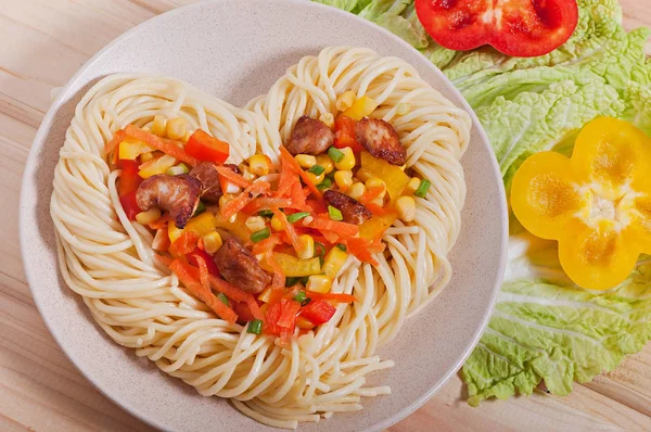 Pasta with vegetables and turkey meat, diet menu. Valentine\'s Day.