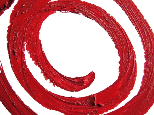 Lápiz labial RED espiral manchado sobre fondo blanco — Foto de Stock