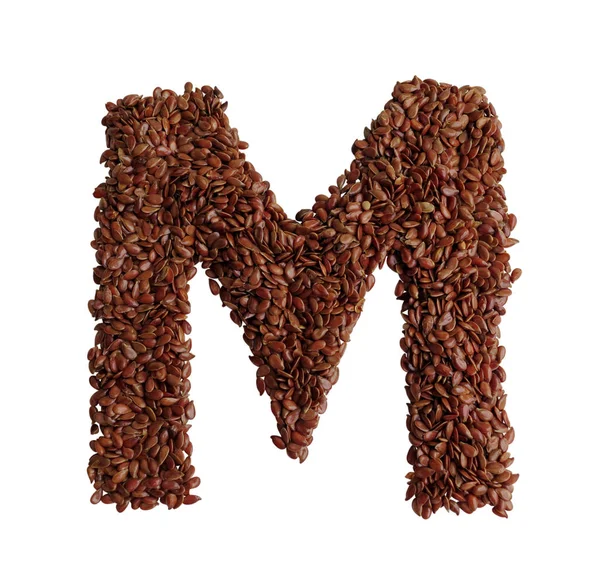 Letter M made with Linseed also known as flaxseed isolated on wh Royalty Free Stock Photos