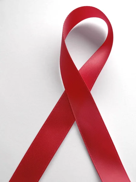 Red ribbon aids awareness isolated on white background — Stock Photo, Image