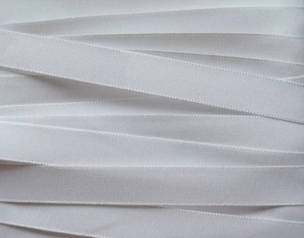 Shiny white satin ribbon — Stock Photo, Image