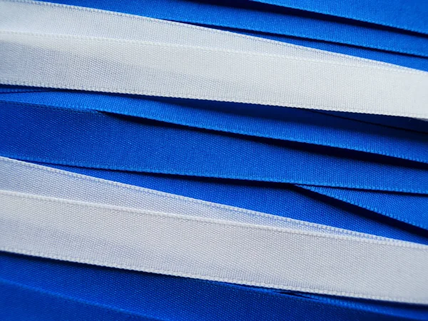 Shiny blue and white satin ribbon — Stock Photo, Image