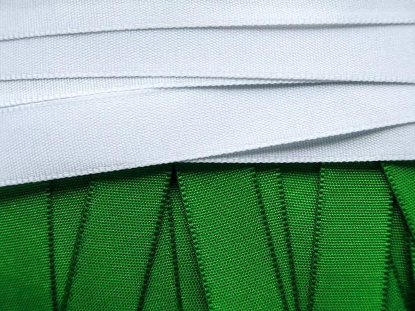 Green and white satin ribbon background — Stock Photo, Image