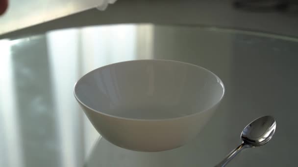 Pours Cornflakes White Deep Dish Glass Table Slow Motion — Stock Video