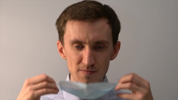 Close Portrait Young Man Putting Medical Mask — Stock Video