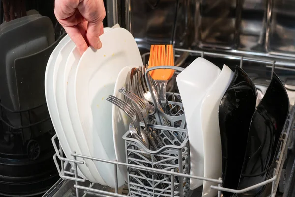 Hand Puts Dirty Dishes Dishwasher — Stock Photo, Image