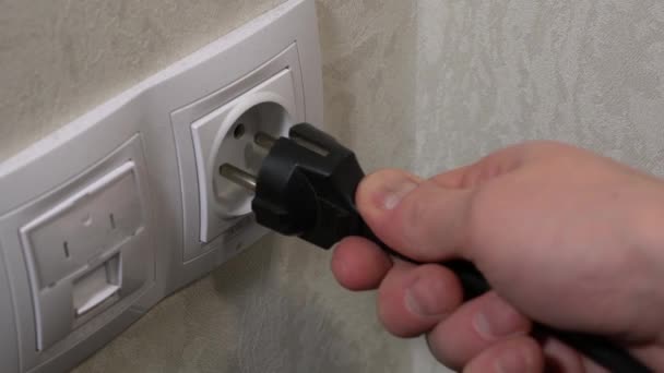 Male Hand Inserts Plug Outlet Takes Out — ストック動画