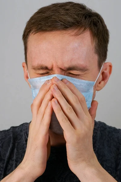 Man Medical Mask Sneezes His Hands — Stock Photo, Image