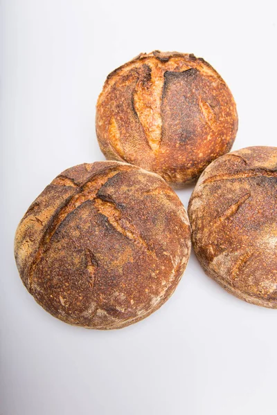 Loafs of round artisan sourdough bread — Stock Photo, Image